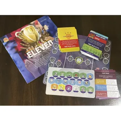 Eleven International Cup expansion components with tournament board, cards, tokens, and rulebook.