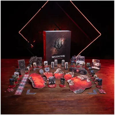 Malediction Primal Blood faction box with cards, terrain pieces, tokens, dice, and standees set up on a table.