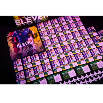 Eleven International Players expansion components with player cards, tactic cards, and football tokens.