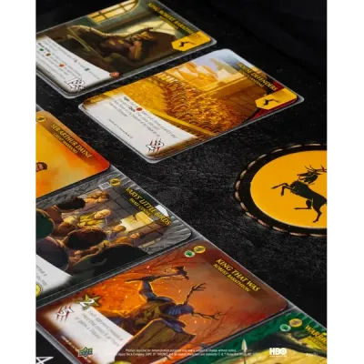 Legendary: Game of Thrones card close-up showing character and location cards on the game playmat.