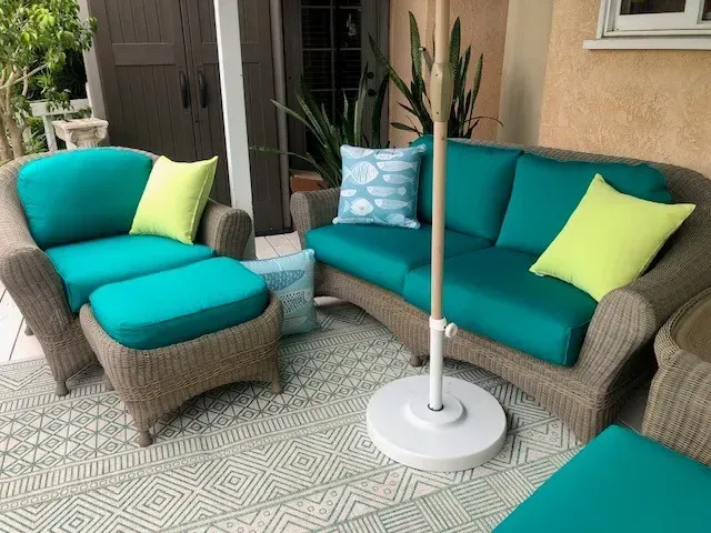 Living Lily Bay Ottoman and Patio Furniture - Lifestyle image on a back porch