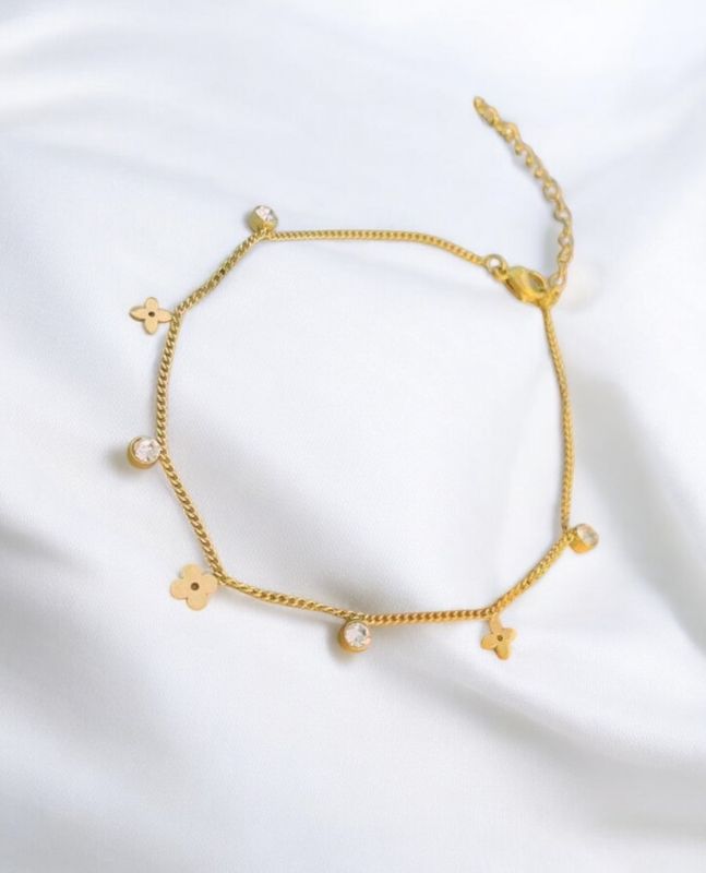Guldpläterat armband blomma  fyrklöver stenar