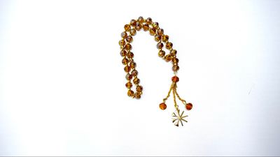 Yezidische Symbol Tesbih in Farbe Gold