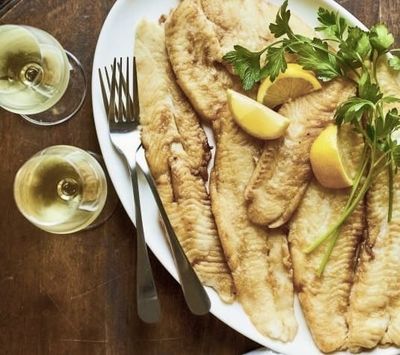Turbot fillet butter meunière with French-style peas and glazed potatoes