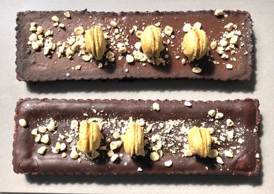 Duo of Mirrored Semi-Cooked Chocolate Tarte with Aromatic Macarons