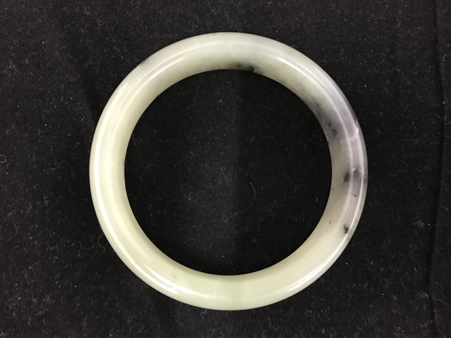 A Chinese or South East Asian Celadon Jade Bangle