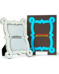 Jonathan Adler Enamel Frames 1 White $62 1 Black $62 1 white SOLD Still needs 1 Black