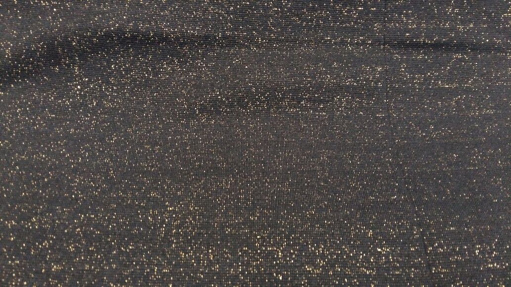 Boordstof glitter zwarte achtergrond goud glitters