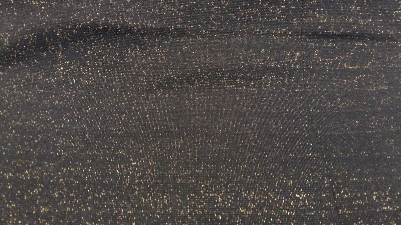 Boordstof glitter zwarte achtergrond goud glitters