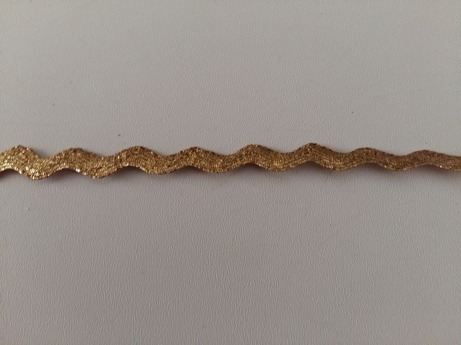 Zigzag band glitter goud