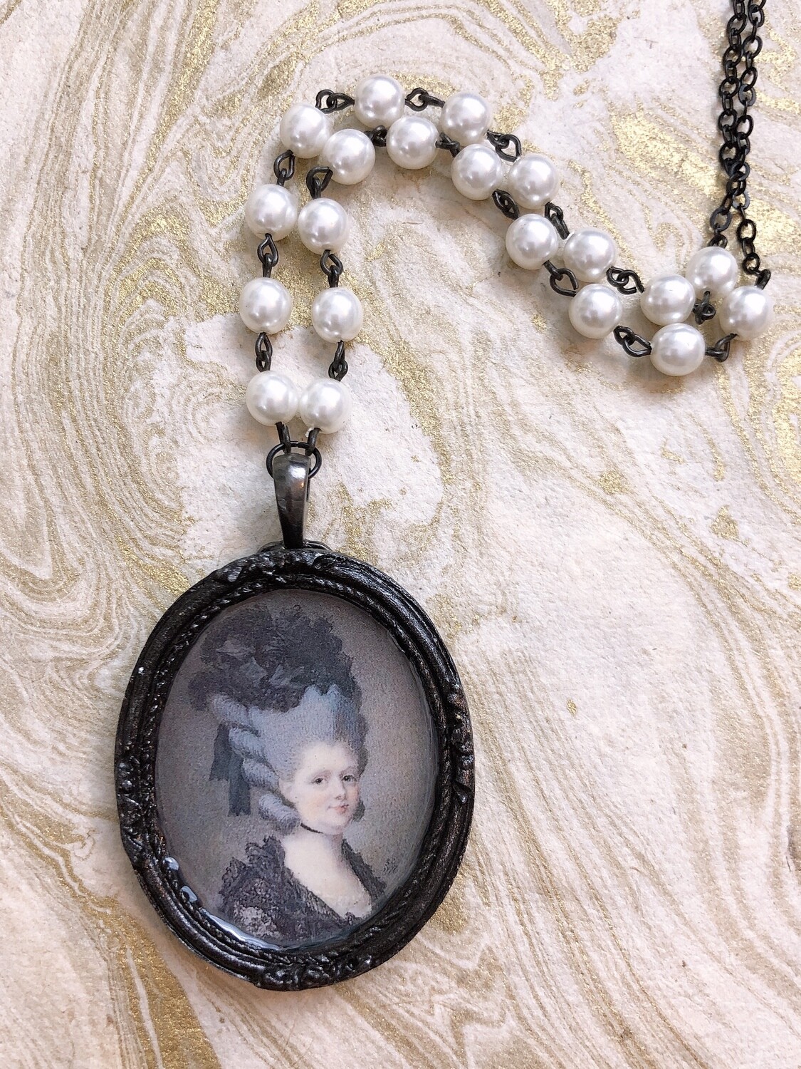 frame necklace (lady in black)