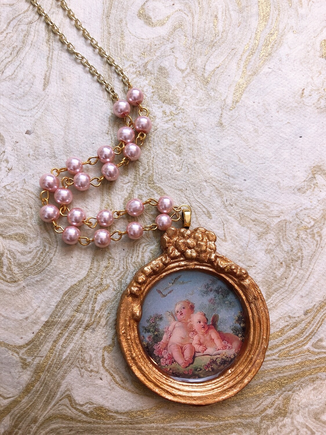 frame necklace (cherubs)