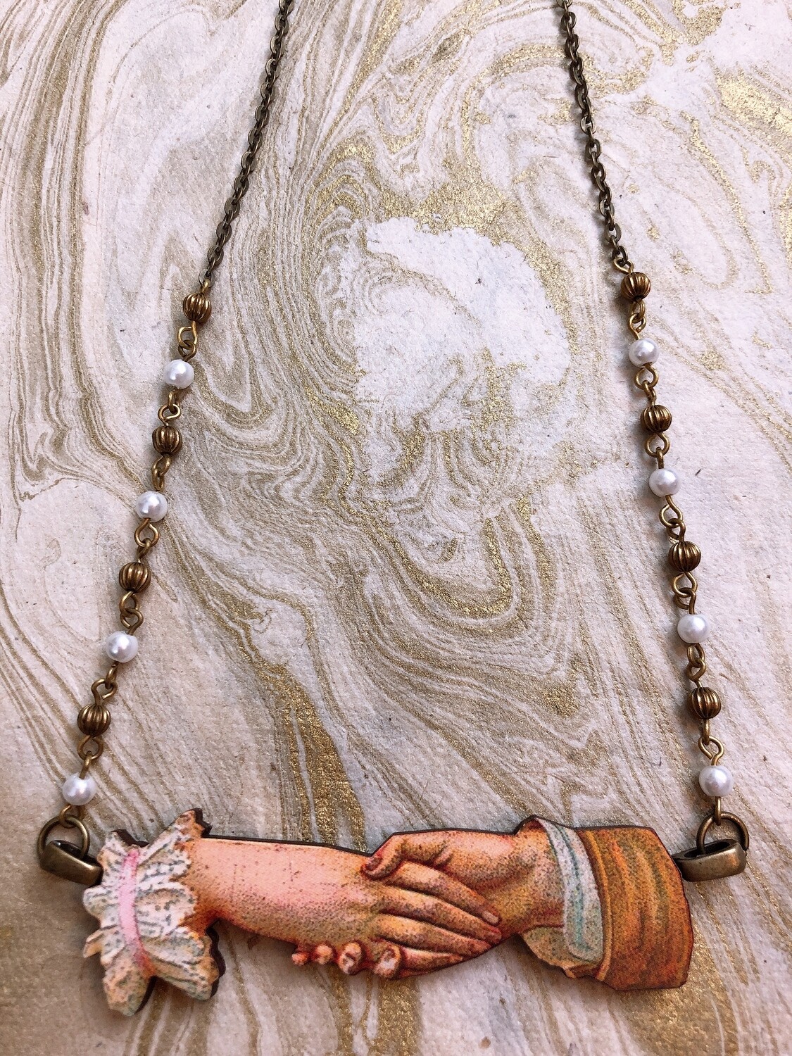 wood necklace (the handshake)