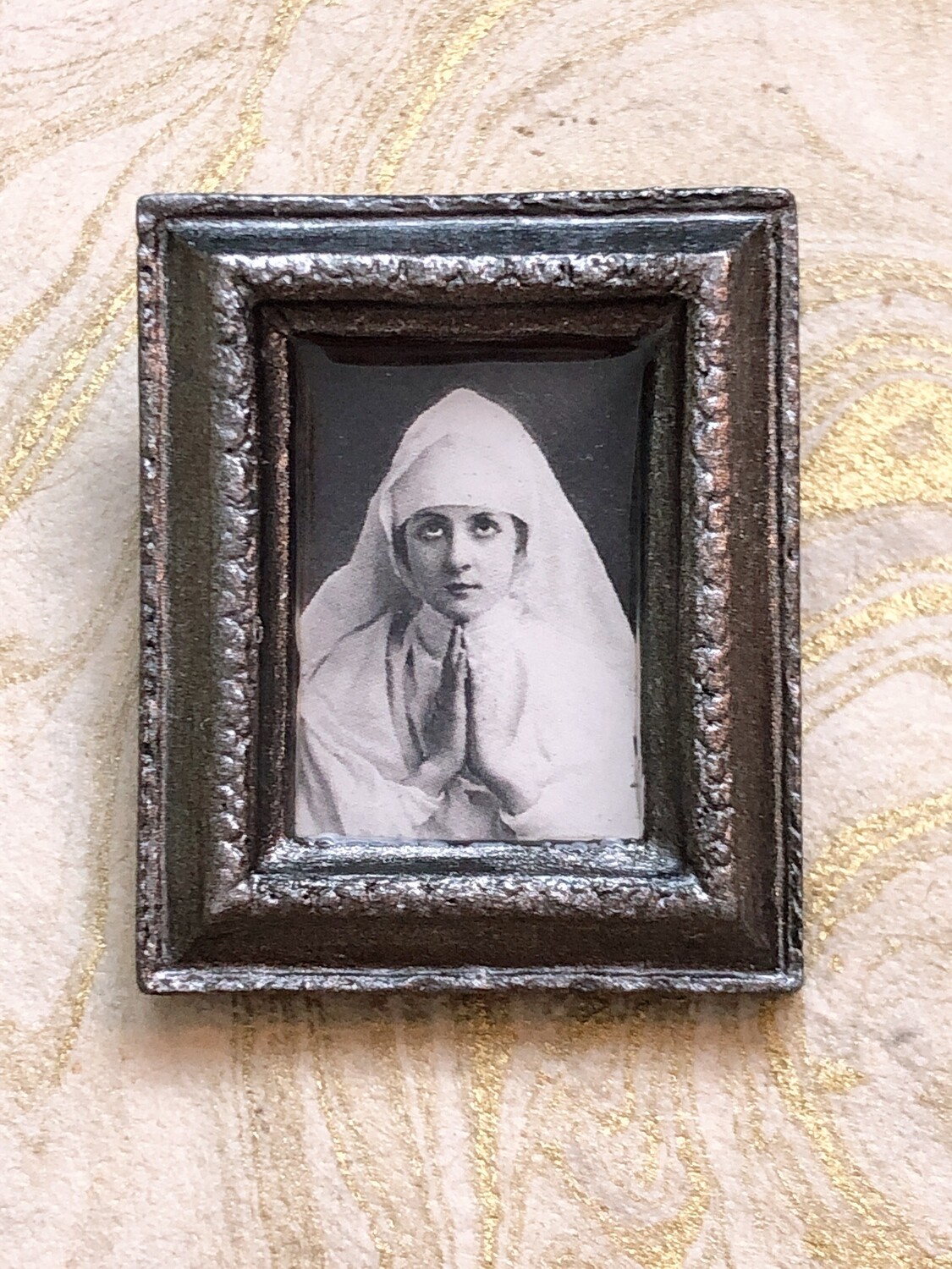 frame brooch (the nun)