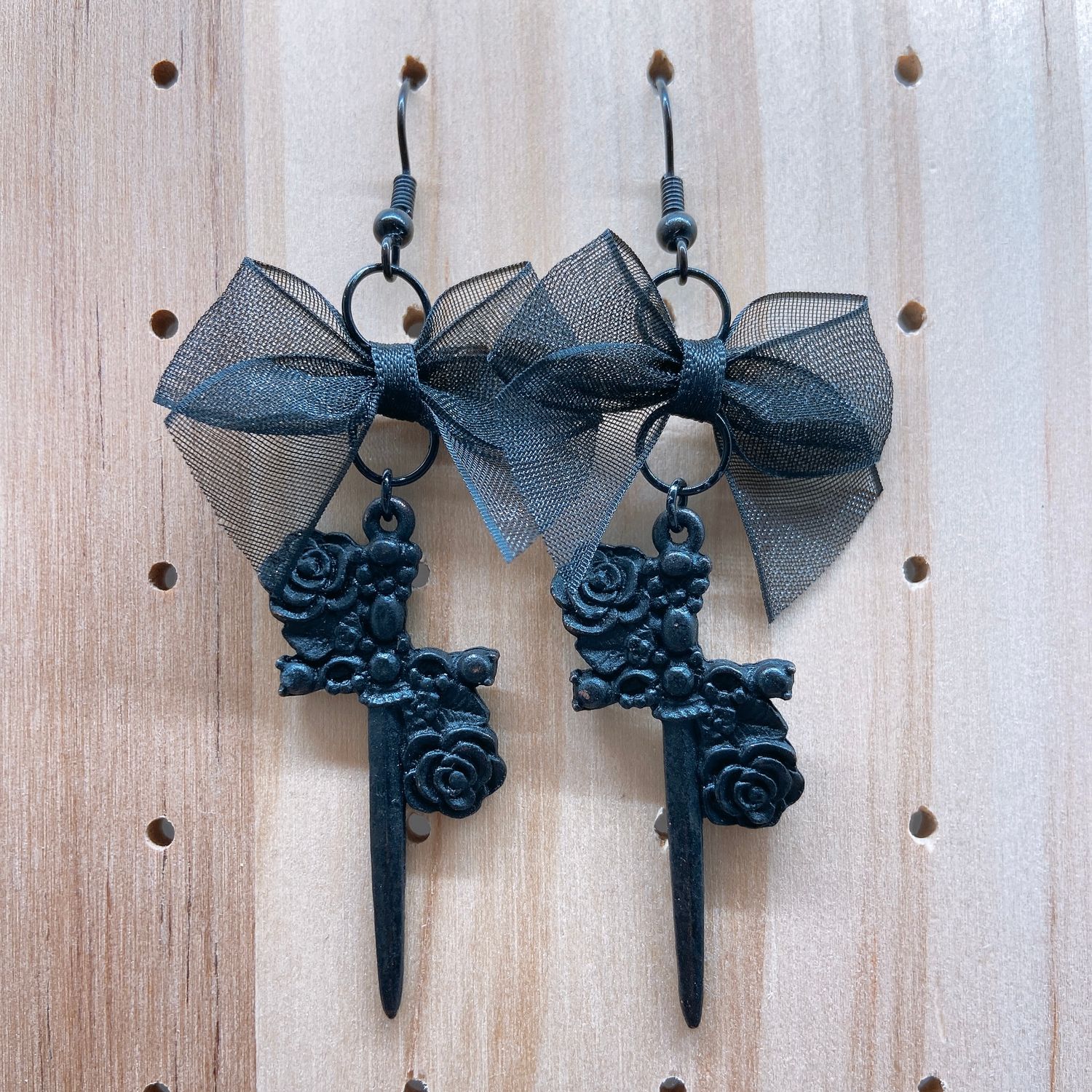floral sword earrings