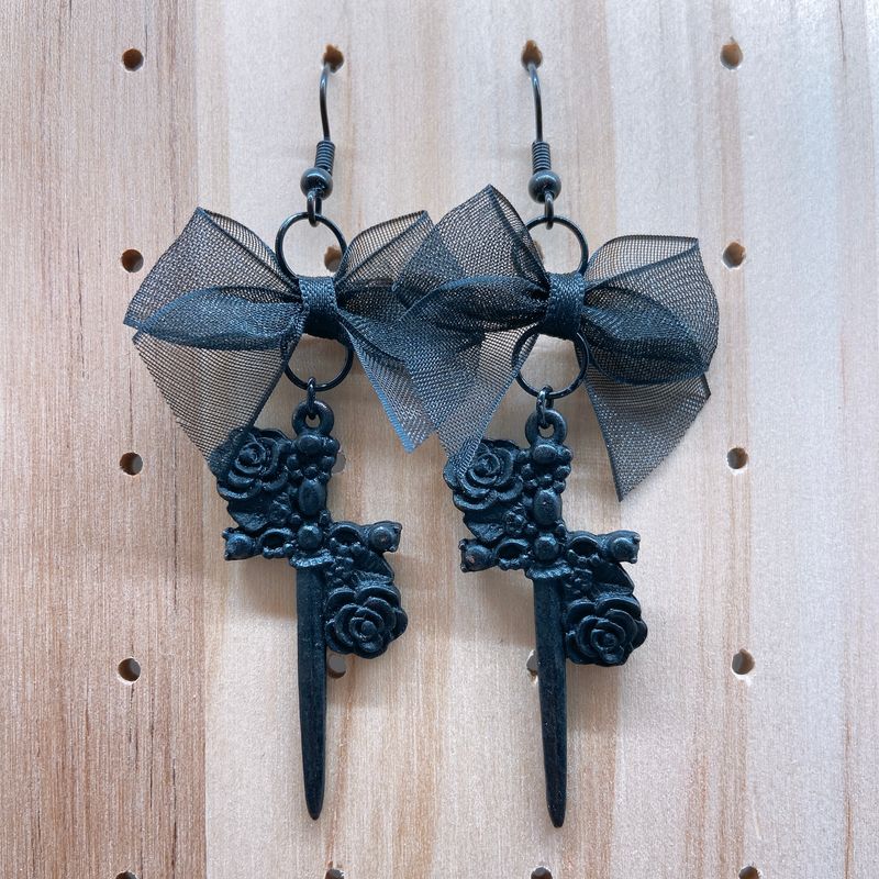 floral sword earrings