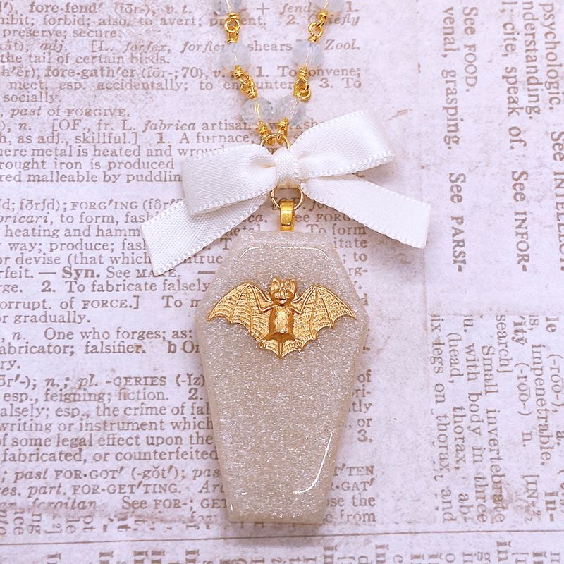 white glitter bat coffin necklace
