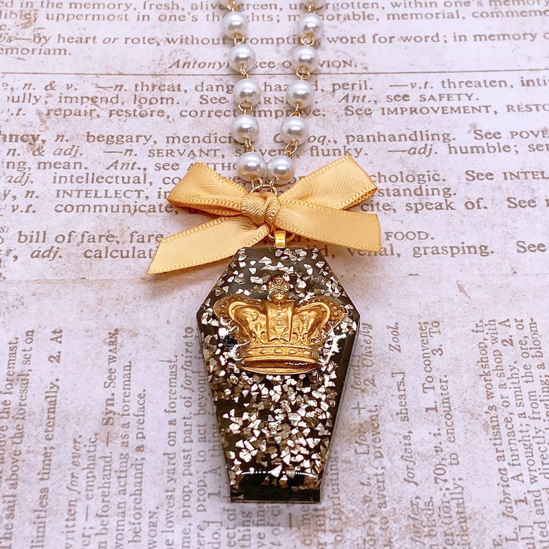 golden crown coffin necklace