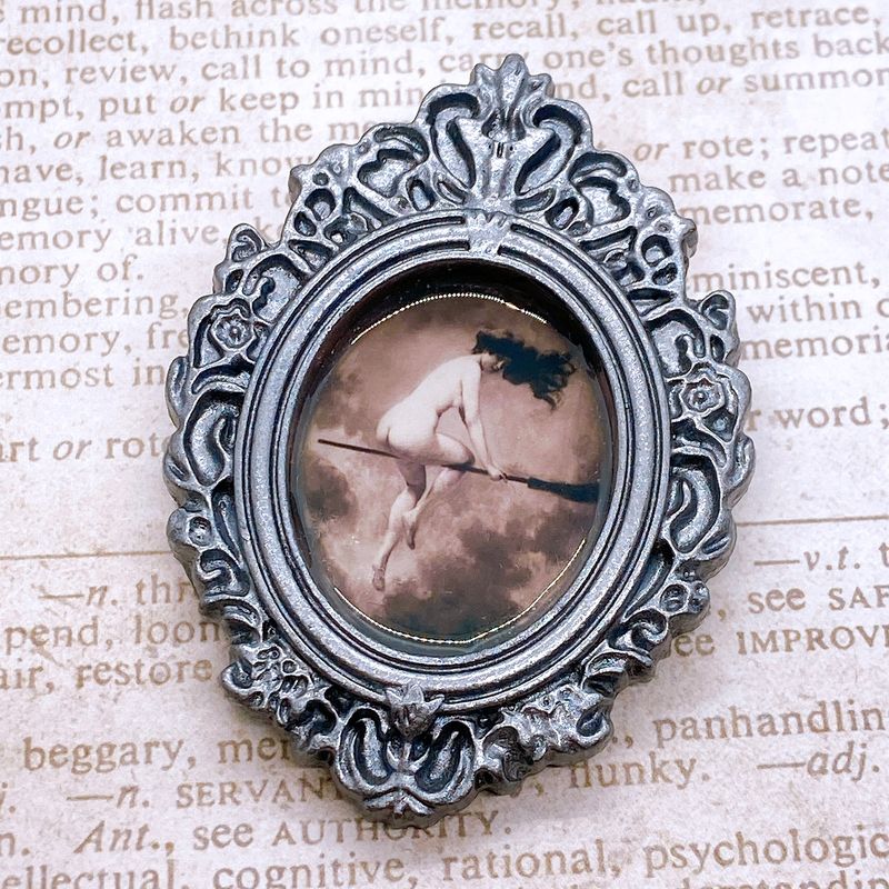 frame brooch (witch in flight)