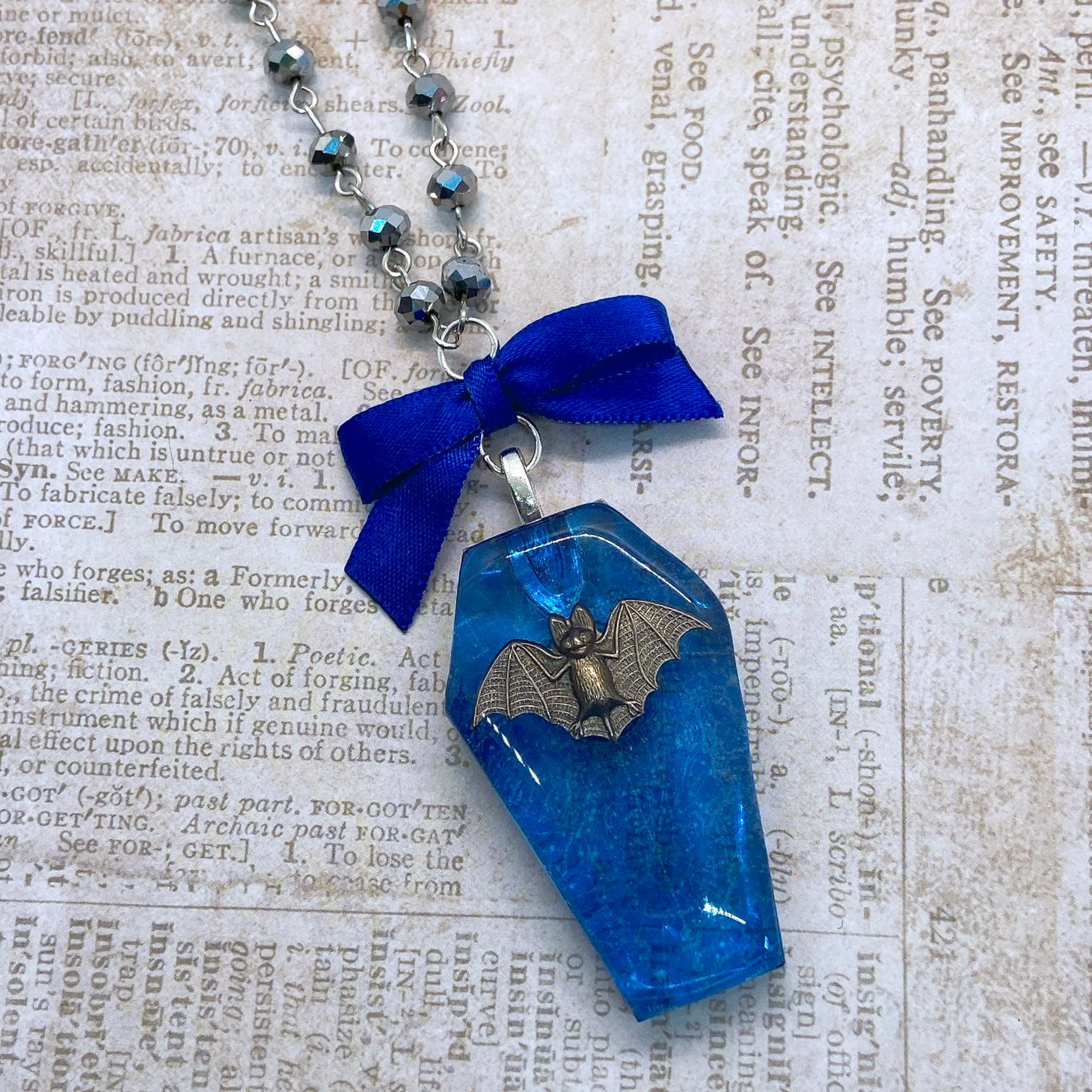 celestial bat coffin necklace