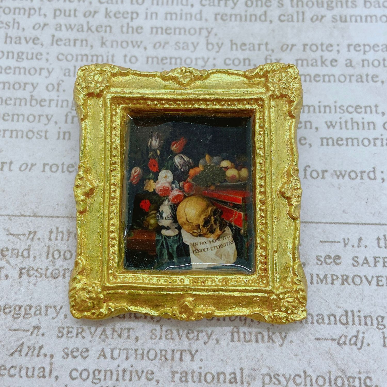 frame brooch (vanitas with skull, fruit, and flowers)