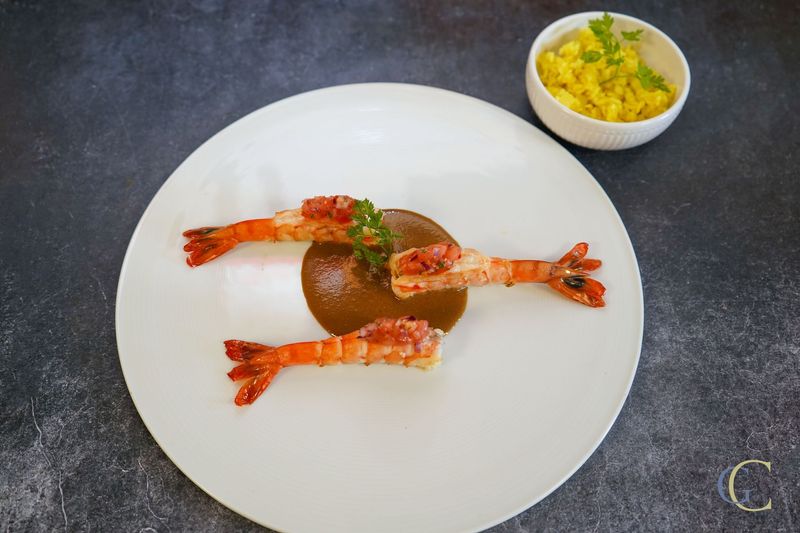 Carry de Cameron Zembrocal, bisque créole, rougail tomate