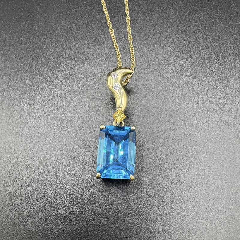 14K EMERALD CUT SWISS BLUE TOPAZ PENDANT