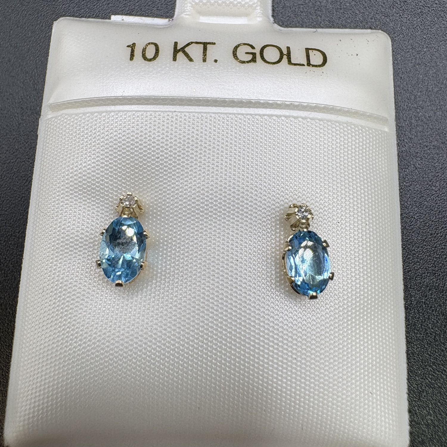 10K BLUE TOPAZ OVAL STUD WITH SMALL DIAMOND