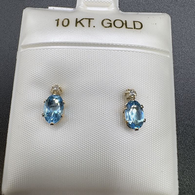 10K BLUE TOPAZ OVAL STUD WITH SMALL DIAMOND