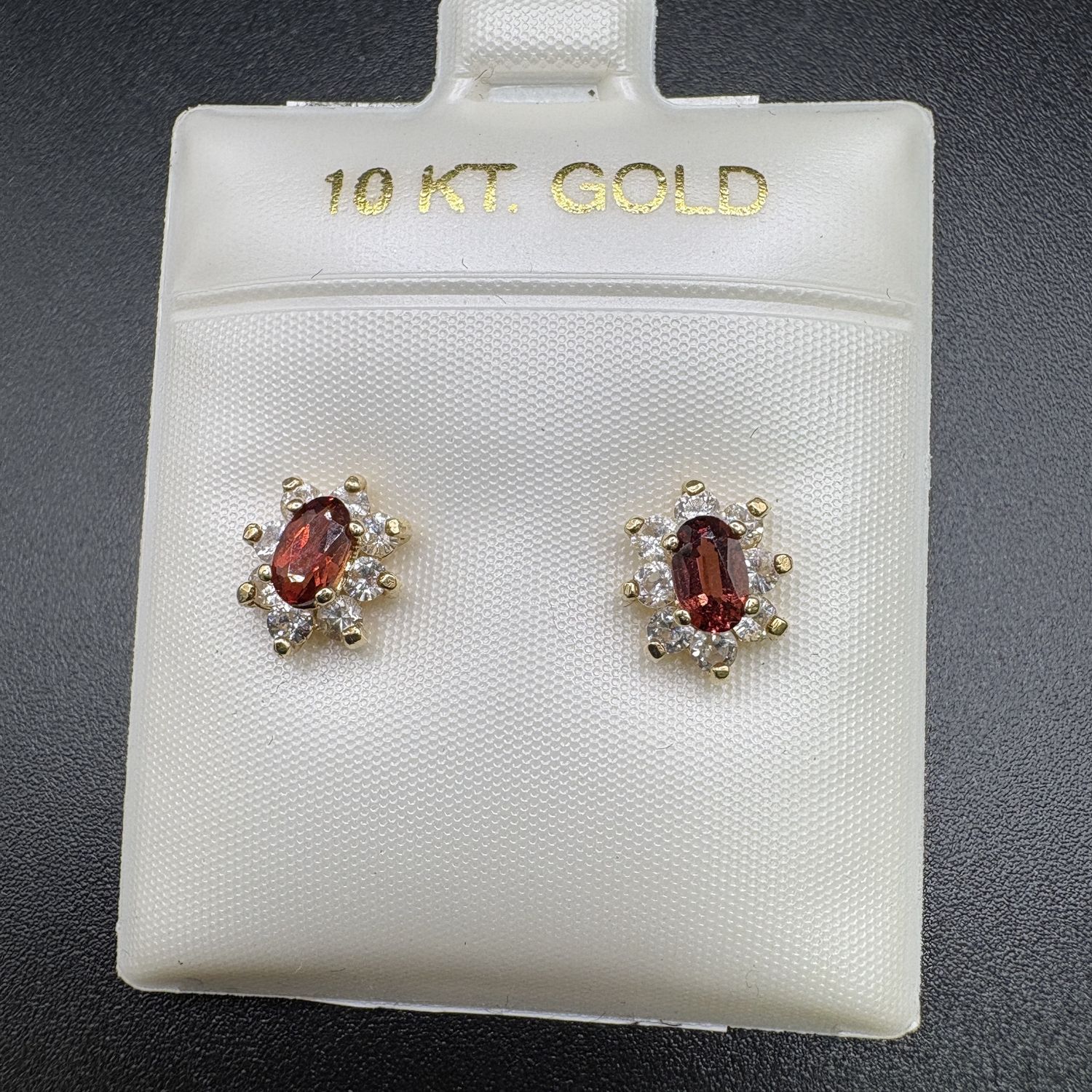 10K OVAL GARNET STUD WITH DIAMOND HALO EARRING