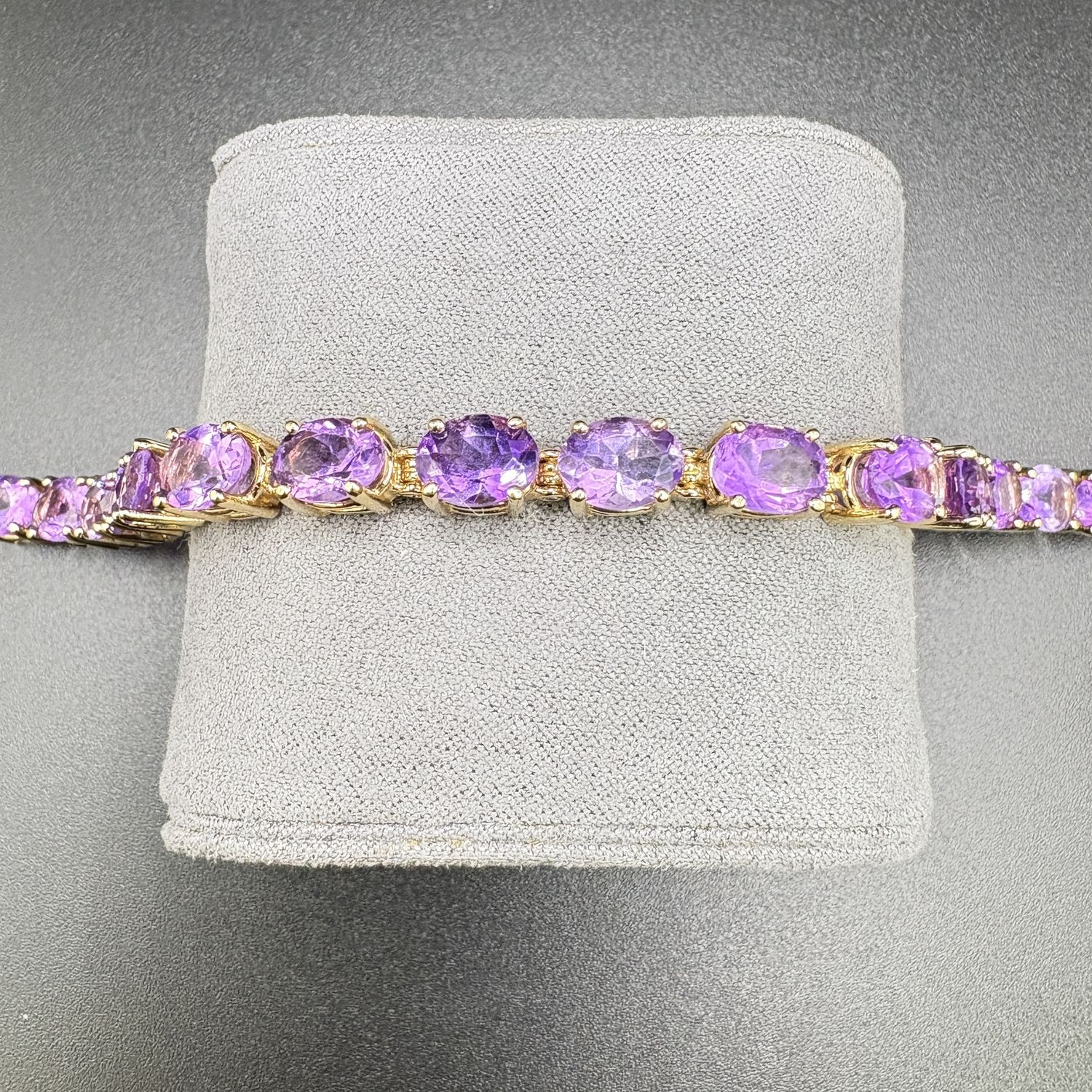14K TENNIS BRACELET WITH OVER 21 CARATS   AMETHYST,  BRAC 18.3G