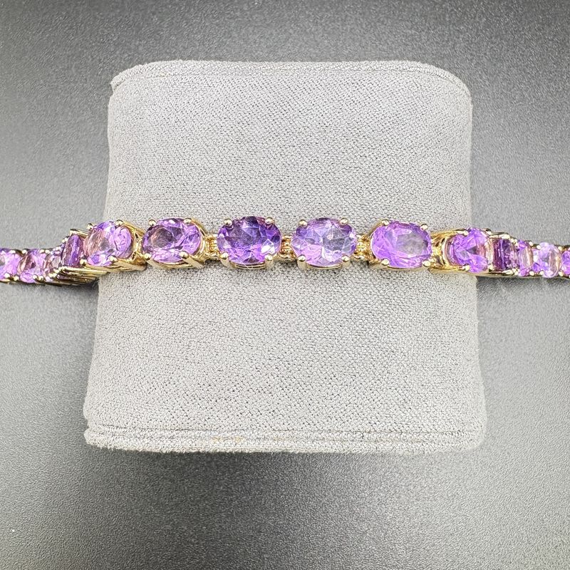 14K TENNIS BRACELET WITH OVER 21 CARATS   AMETHYST,  BRAC 18.3G