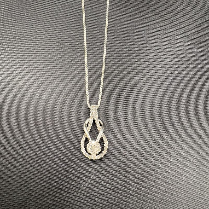 STERLING  7 STONE LOVE KNOT APPROX .25CTW DIAMOND