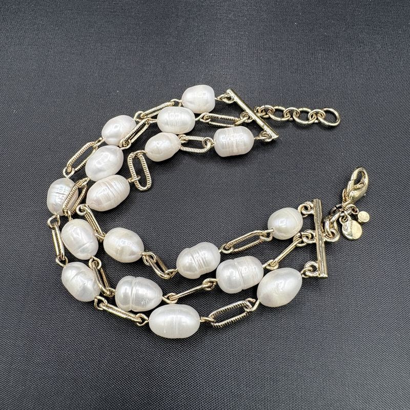 YELLOW GOLD TONED PEARL THREE STRAND 8" BRACELET