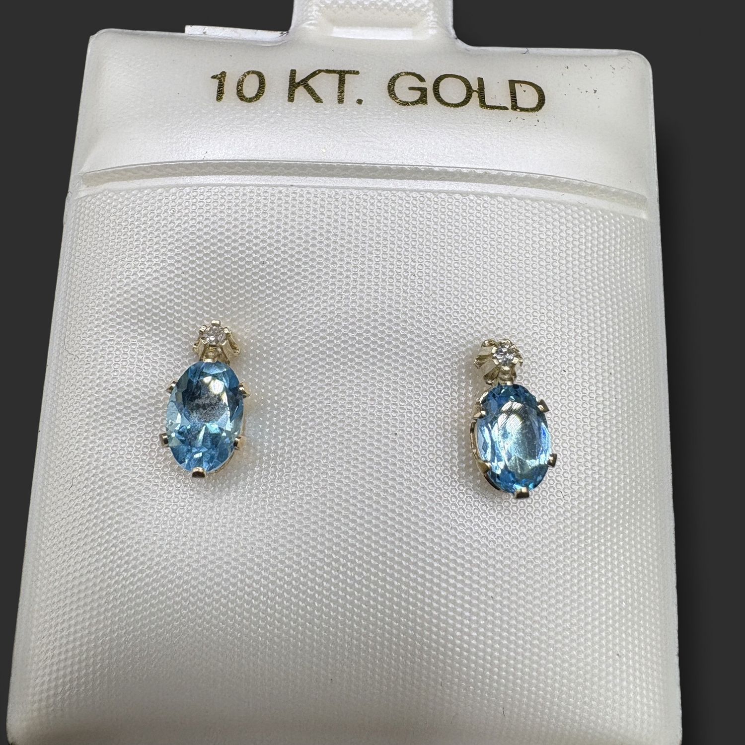 10K BLUE TOPAZ OVAL STUD WITH SMALL DIAMOND