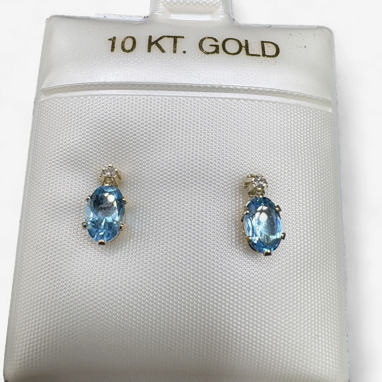 10K BLUE TOPAZ OVAL STUD WITH SMALL DIAMOND