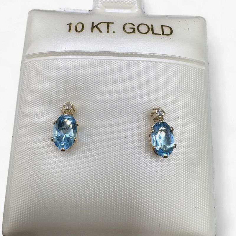 10K BLUE TOPAZ OVAL STUD WITH SMALL DIAMOND