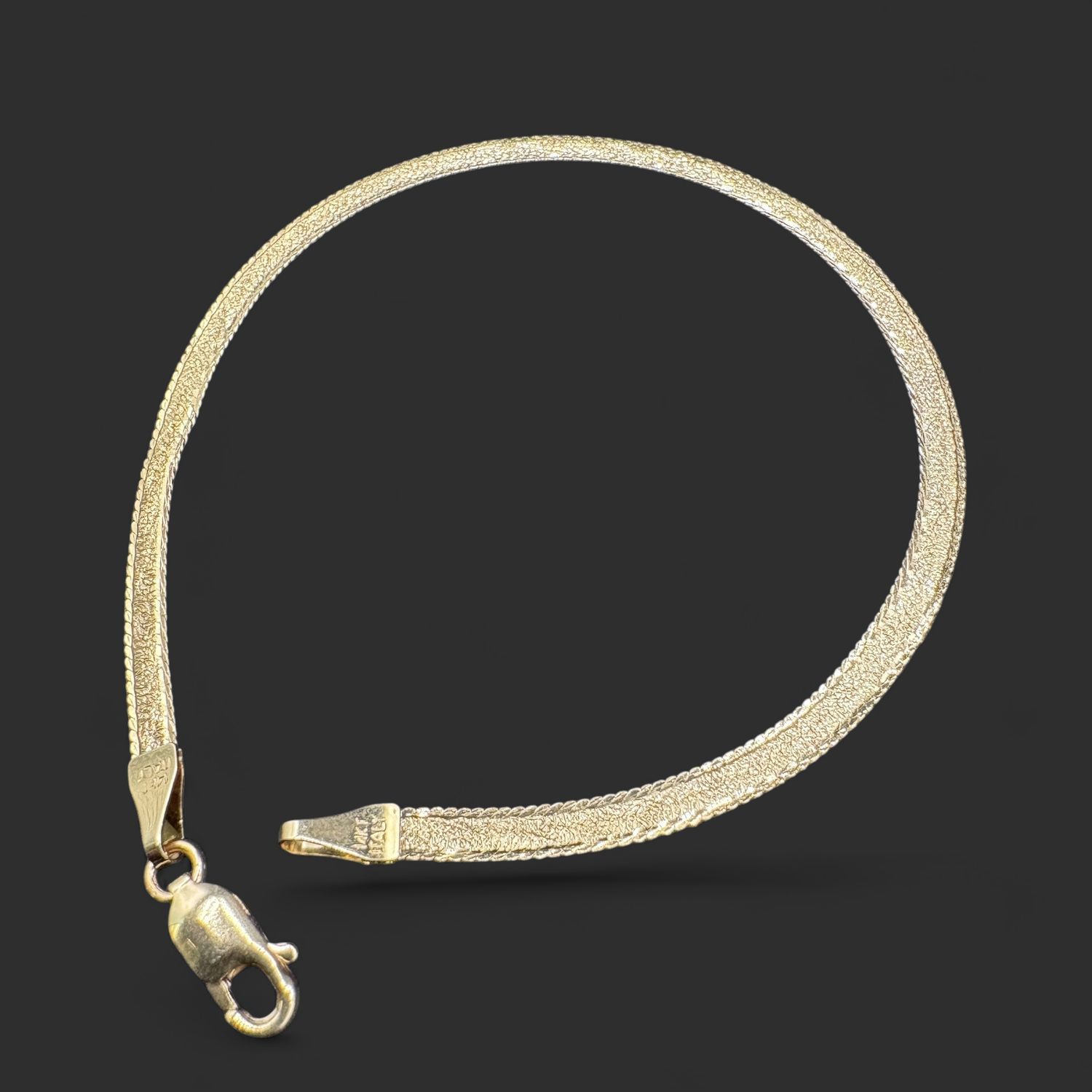 14KY HERRINGBONE 7 INCH BRACLET, 3.8MM WIDE, 2.7 GRAMS