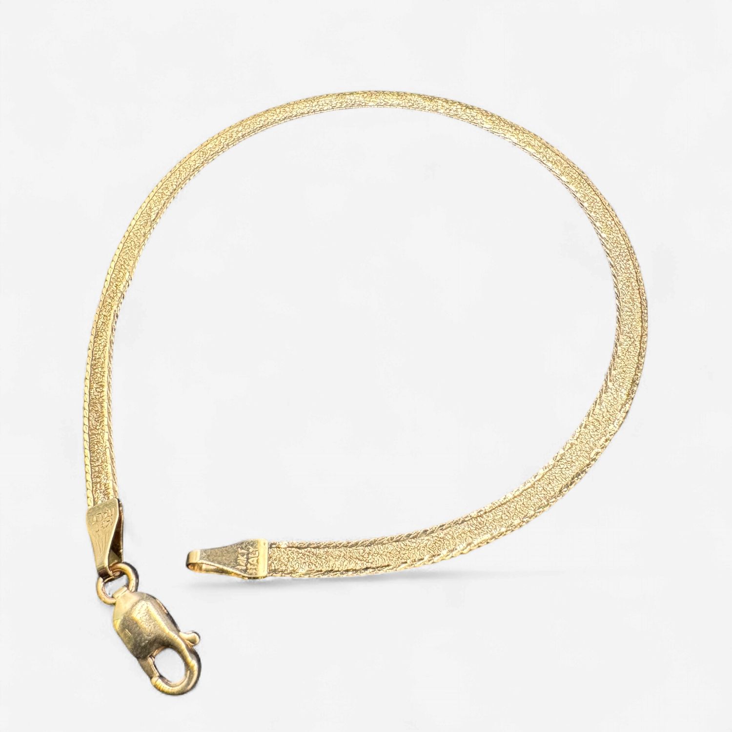 14KY HERRINGBONE 7 INCH BRACLET, 3.8MM WIDE, 2.7 GRAMS