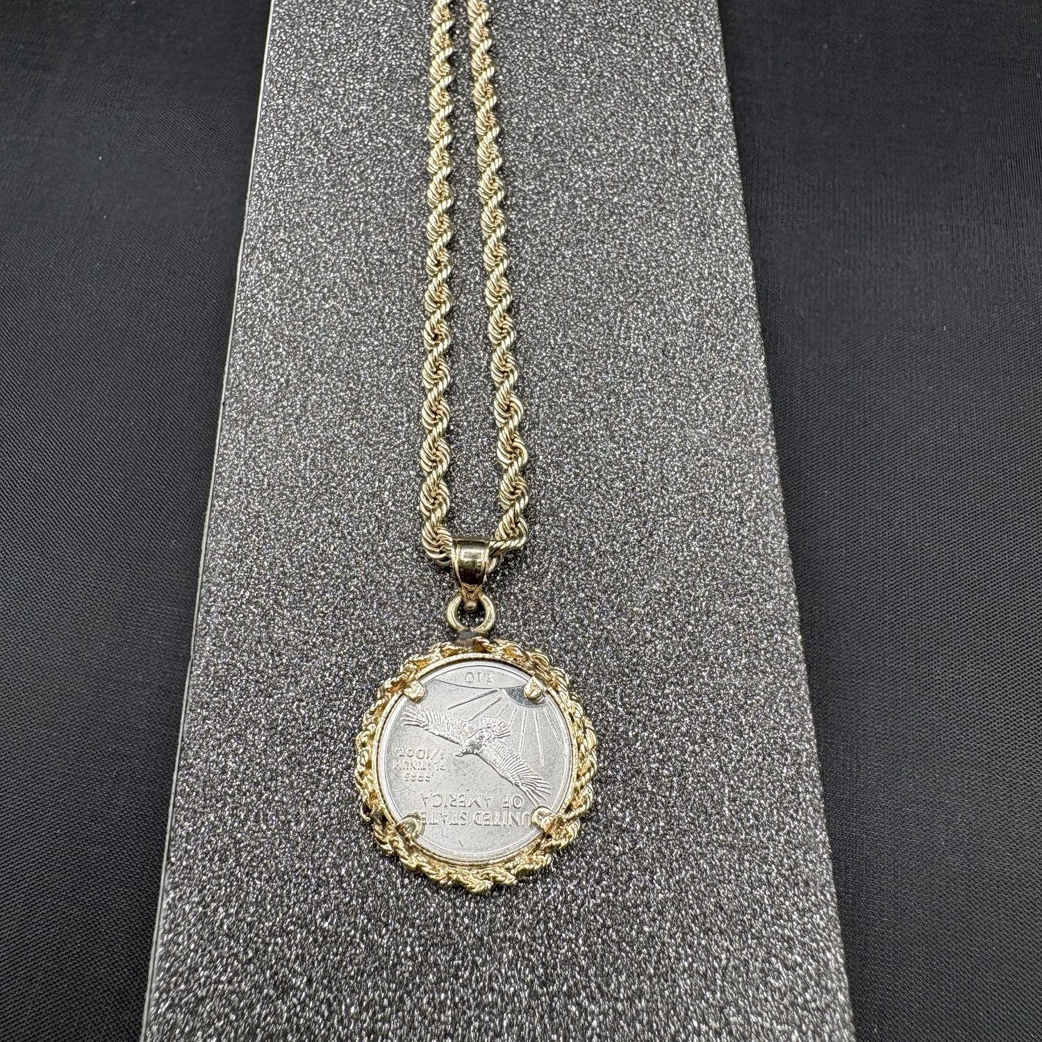 PLATINUM DIME IN A 14K ROPE BEZEL PENDANT