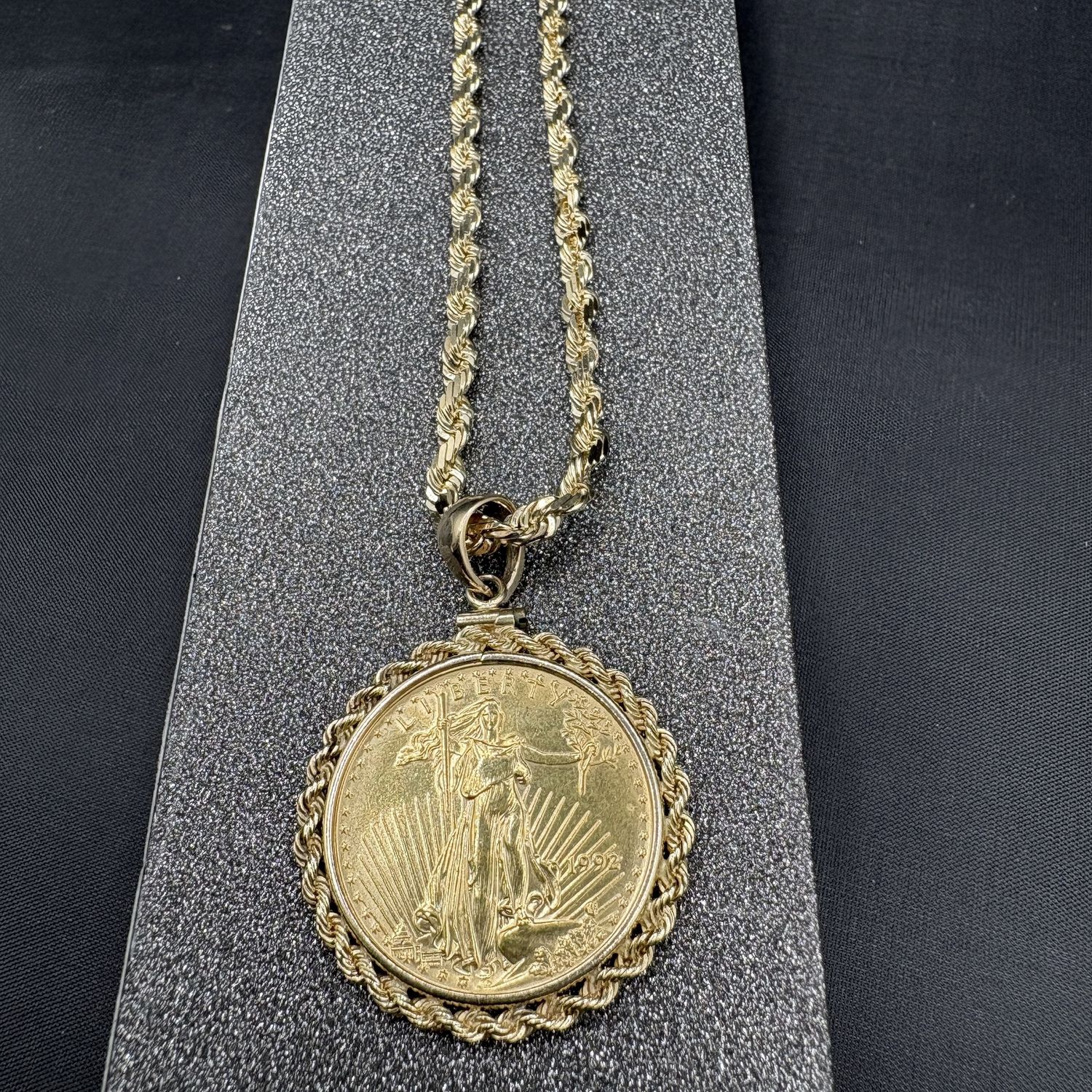 99.9 FINE GOLD 1/2 OZ COIN IN 14K ROPE BEZEL PENDANT