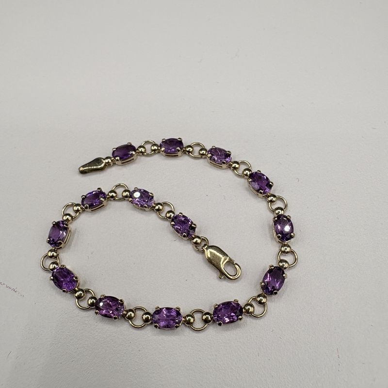 10K OVAL AMETHYST TENNIS BRACELET 7"