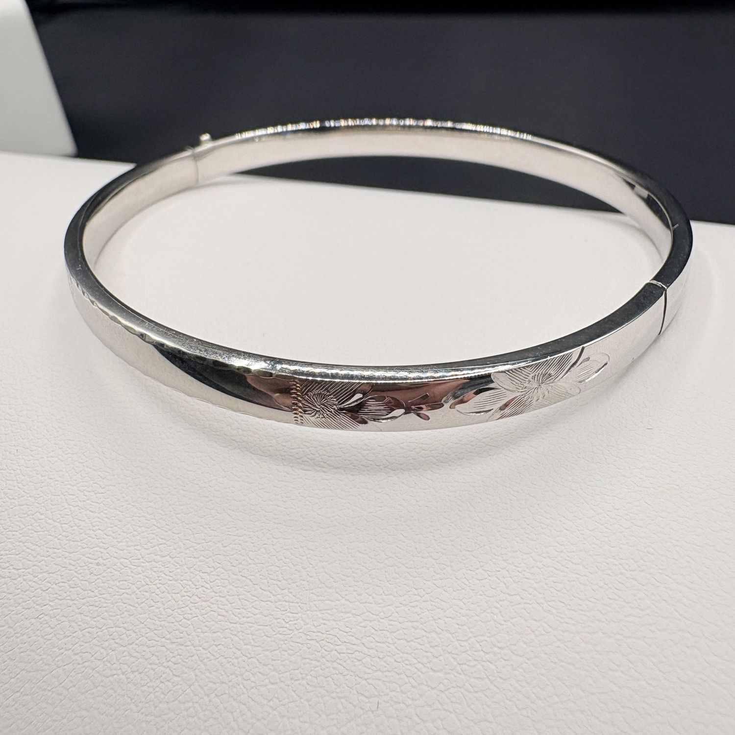 STERLING HARD BANGLE BRACELET WITH FLORAL DESIGN