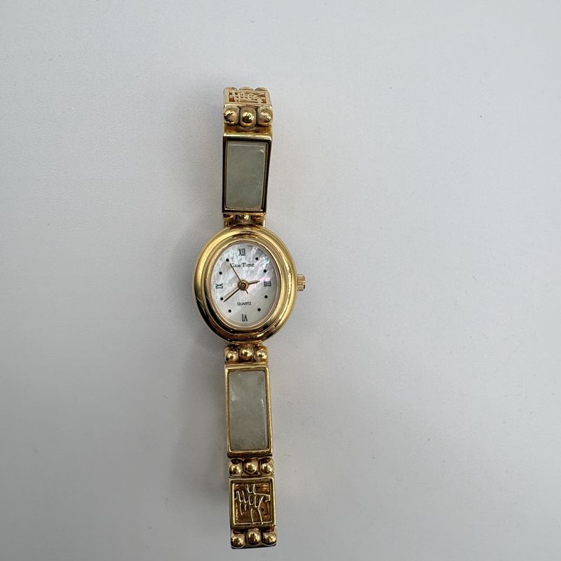 JADE GOLD TONE WATCH WITH MOTHER OF PEARL FACE