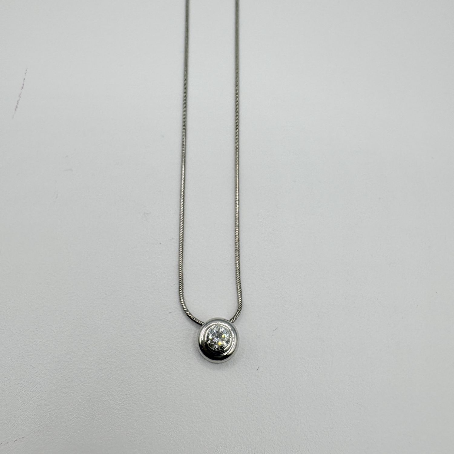 14K BEZEL APPROX .40CTW DIAMOND ON A SNAKE CHAIN 16"