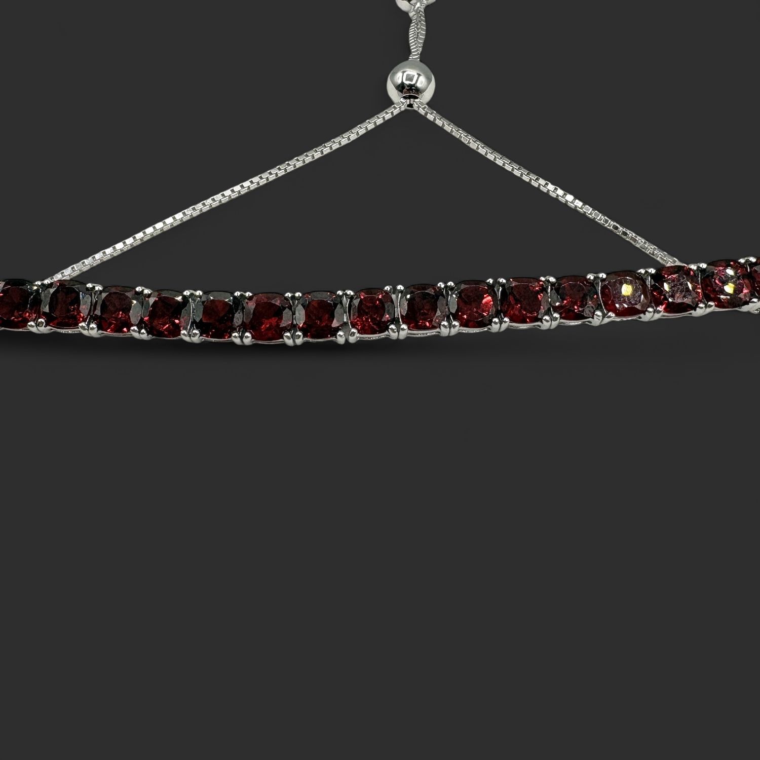 STERLING BOLO GARNET BRACELET