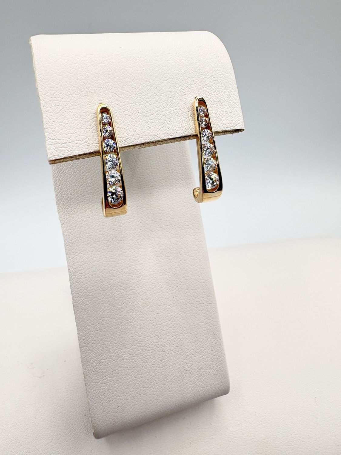 14KY APPROX .50CTW CHANNEL SET DIAMOND J-HOOP EARRING