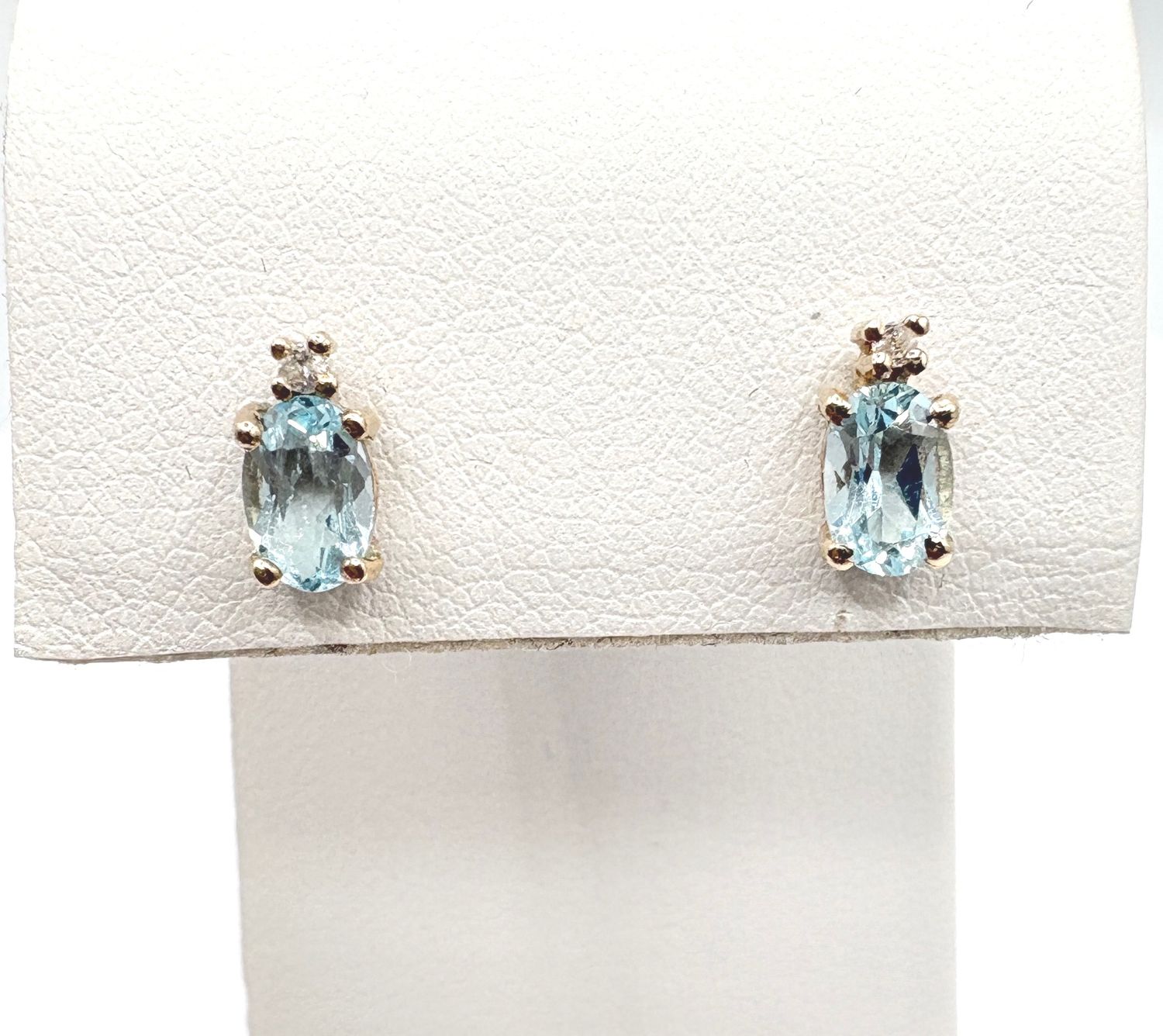 14KY BLUE TOPAZ 4X6 OVAL WITH DIAMOND STUD EARRING
