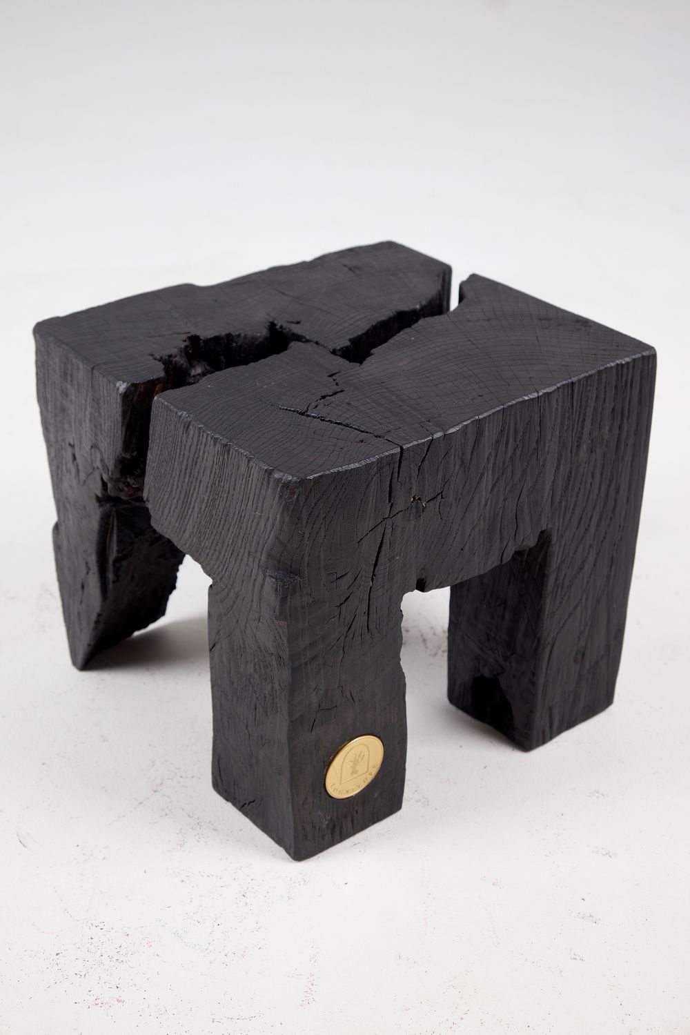Jownik, Charred Split-Leg Stool – Primitive Solidity in Sculptural Form Jownik, Charred Split-Leg Stool – Primitive Solidity in Sculptural Form