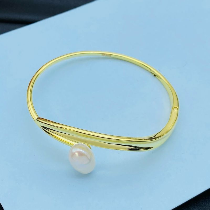 Elegant Gold Bangle with Pearl Accent